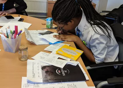 School pupil working at desk