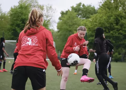 Girls practicing football drills